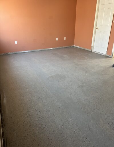 Spotless floor with adjacent wall painted in a vibrant orange color