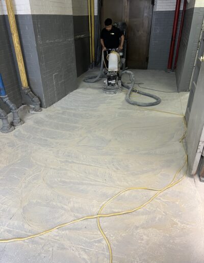 A man is using a machine to clean a floor